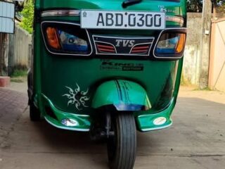 green-three-wheeler-front